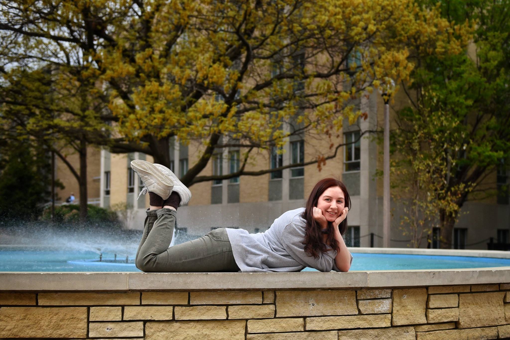 Rachel Patteson on the fountain outside the MU Student Center