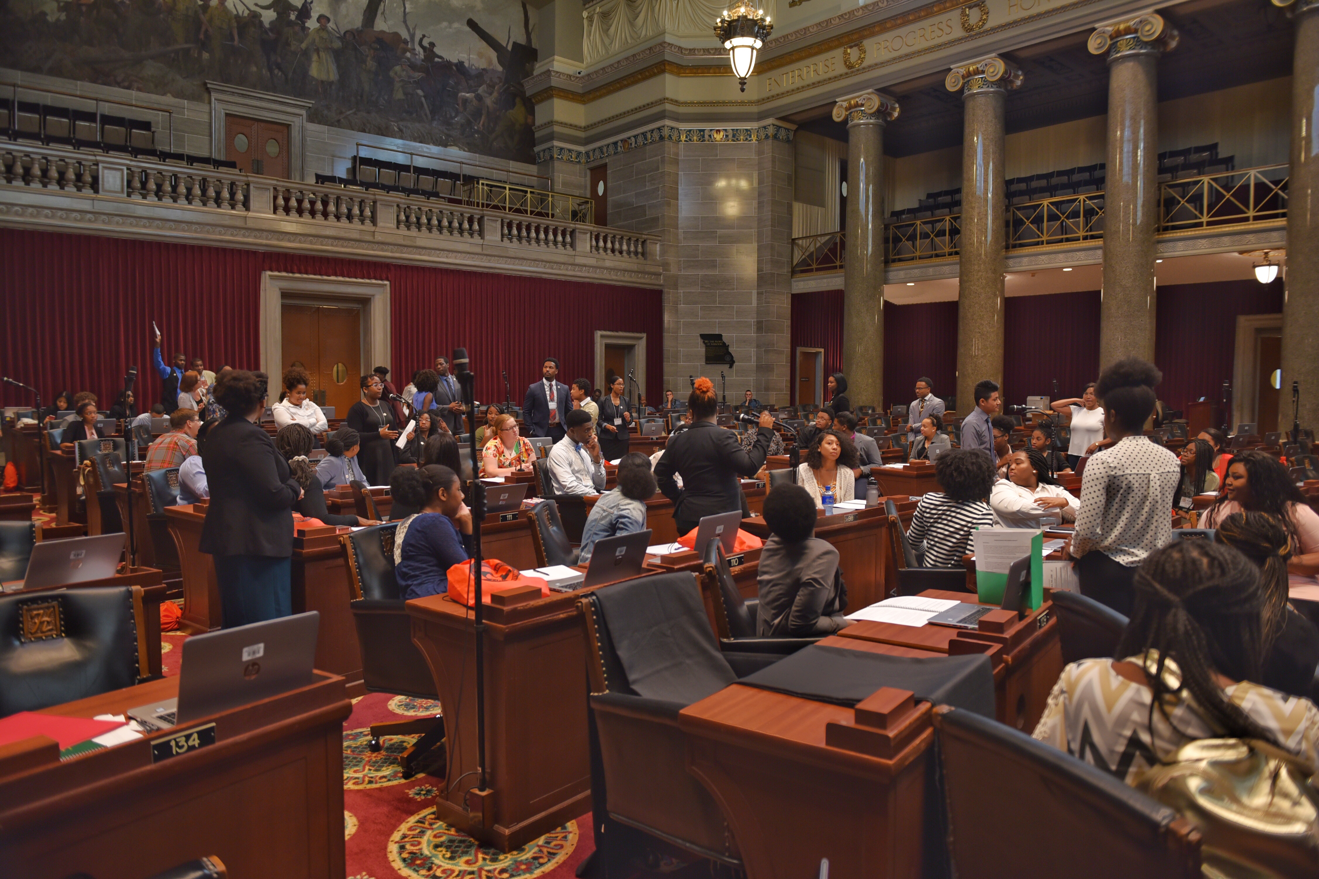 Students work on the floor of the Capitol as part of the Emerging Leaders Conference.
