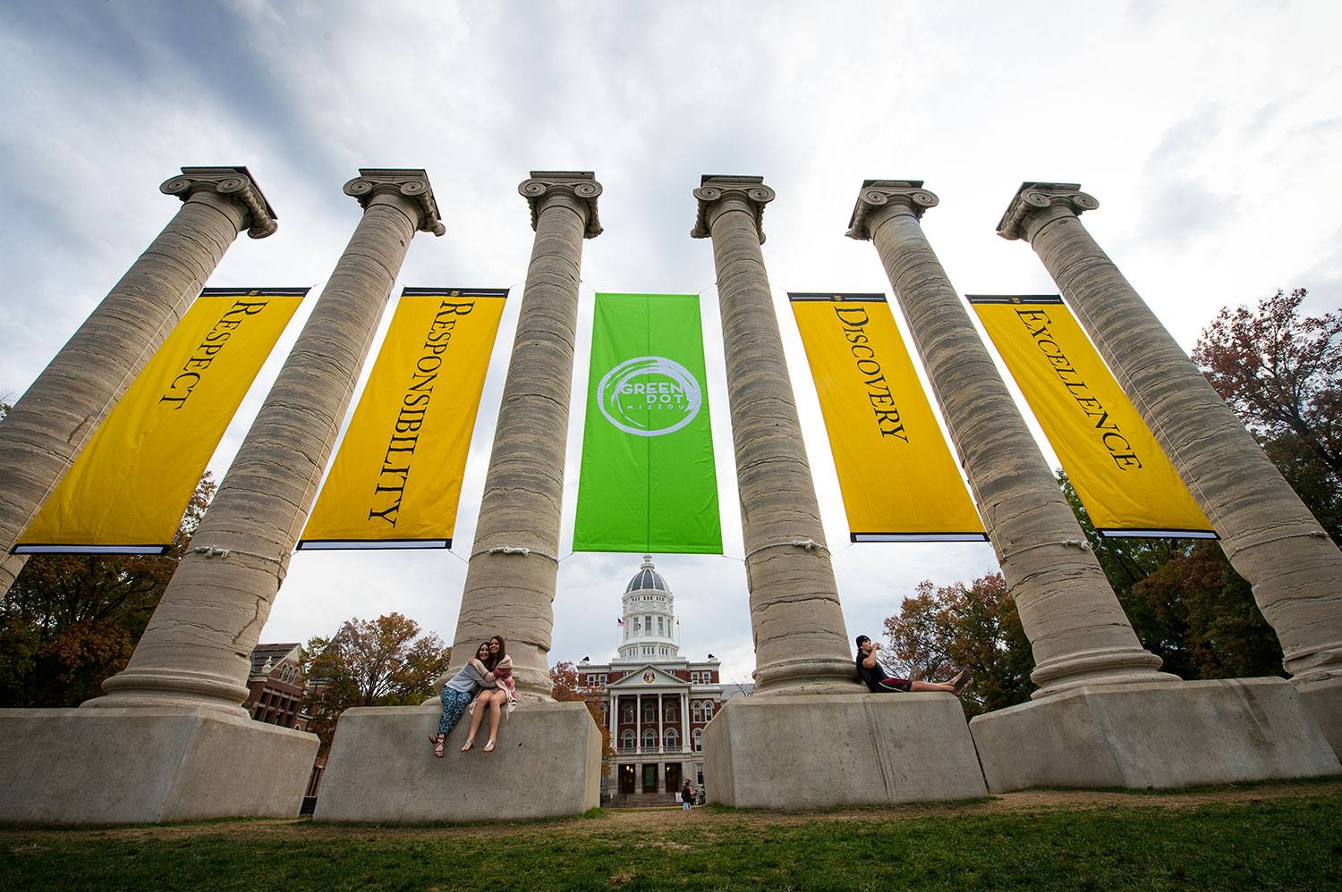 Photo of the Columns with values banners hanging between them and the Green Dot banner in the middle.