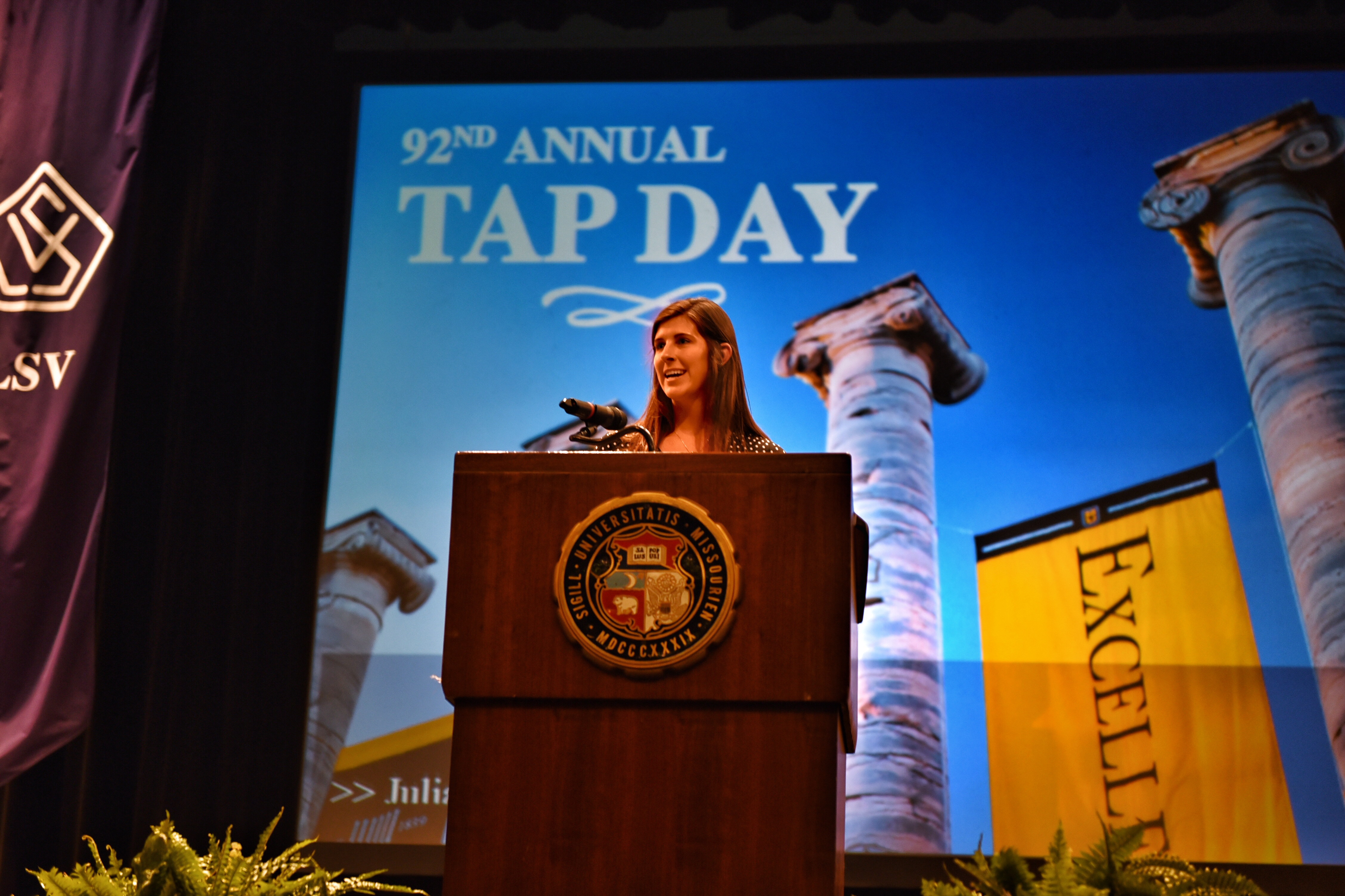 Outgoing MSA President Julia Wopata at the lectern as Tap Day closes
