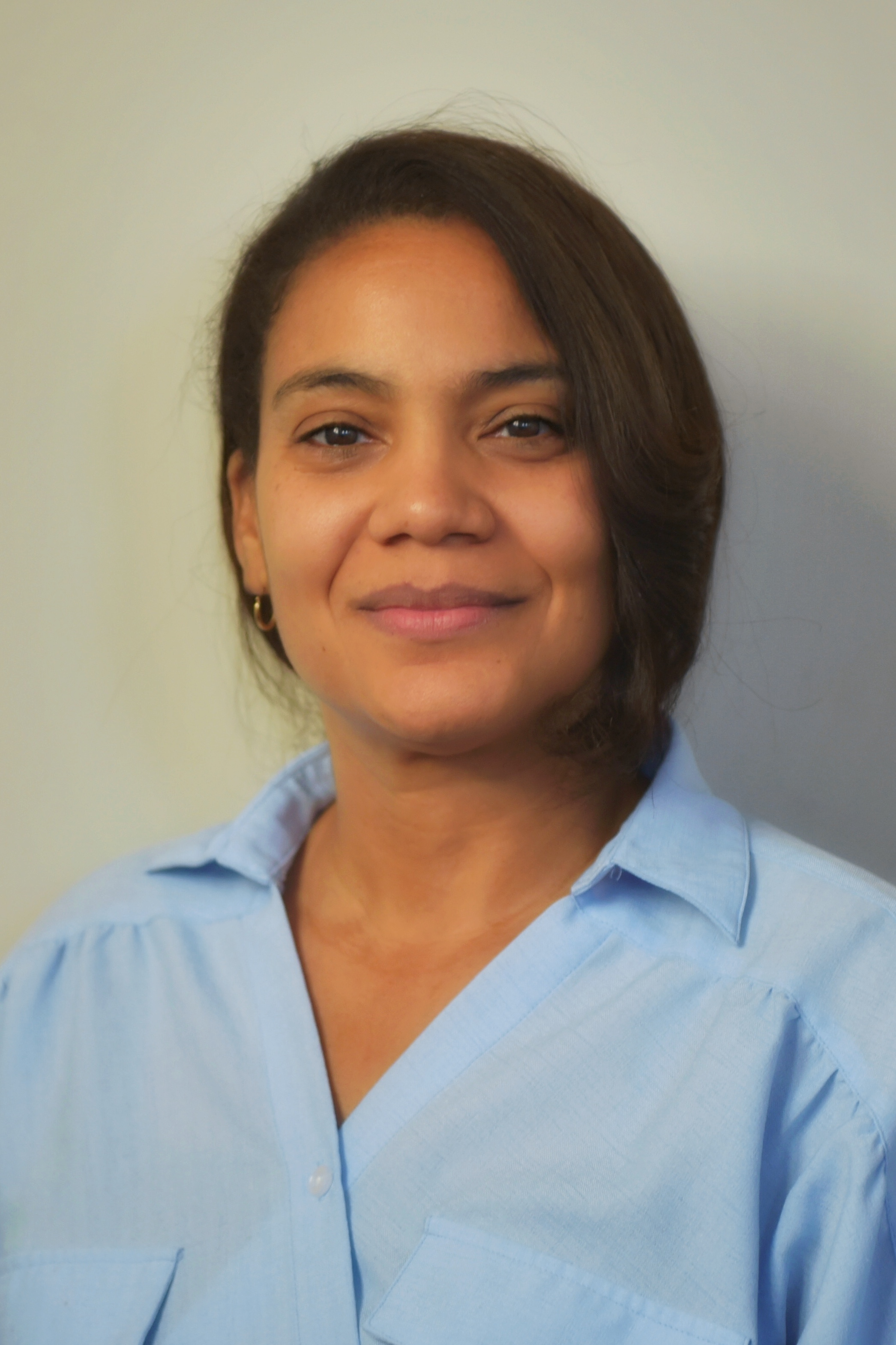 Headshot of NaTashua Davis in a blue shirt.