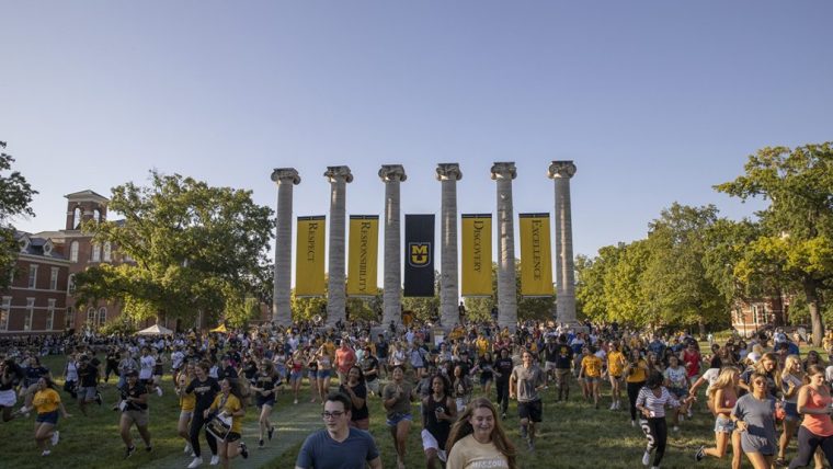 Tiger Walk - students running through our MU's iconic columns toward Jesse Hall.