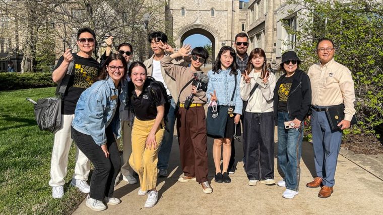 South Korean education influencers pose in front School of Journalism
