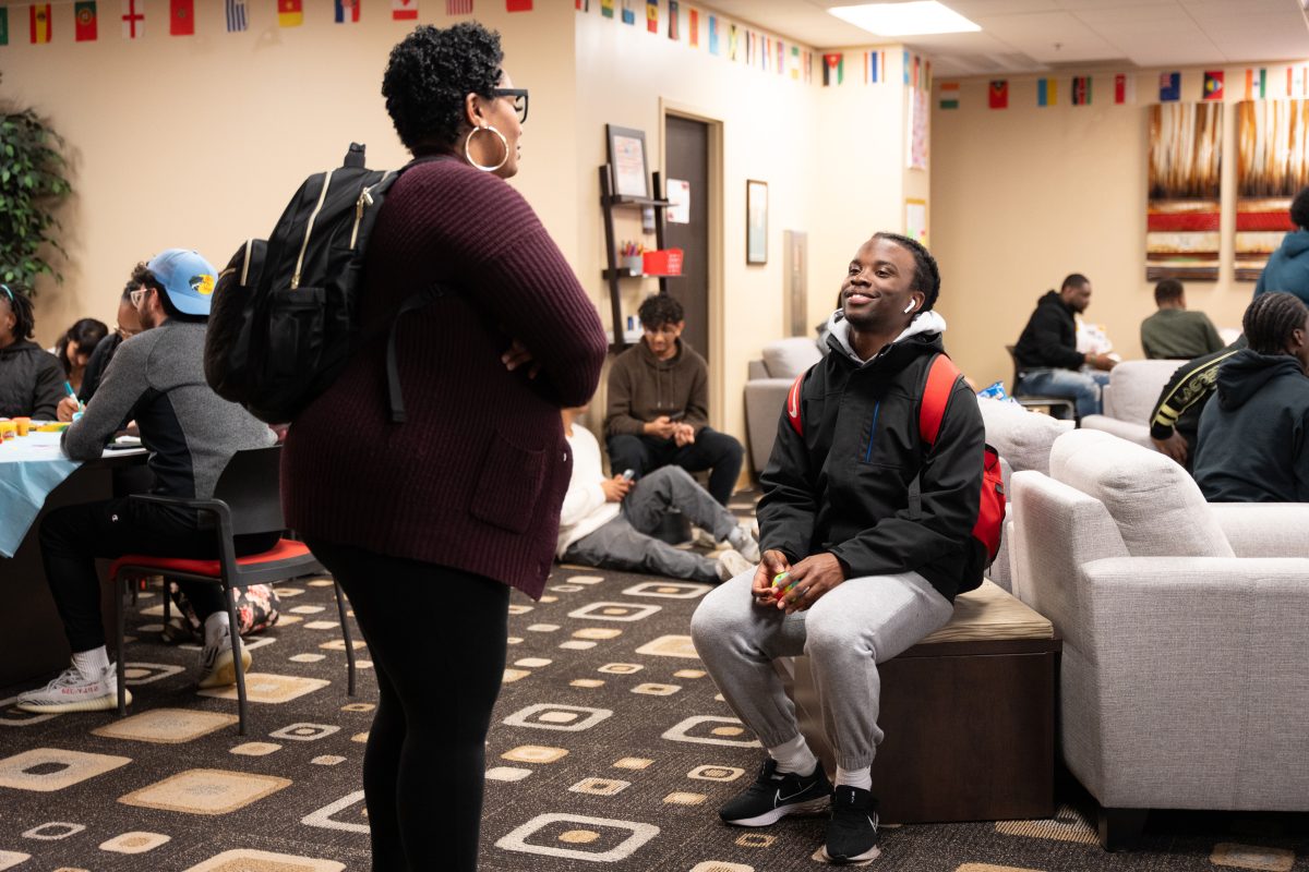 La Toya Stevens, director of communication within the Division of Inclusion, Diversity and Equity speaks with student from Lincoln University. 